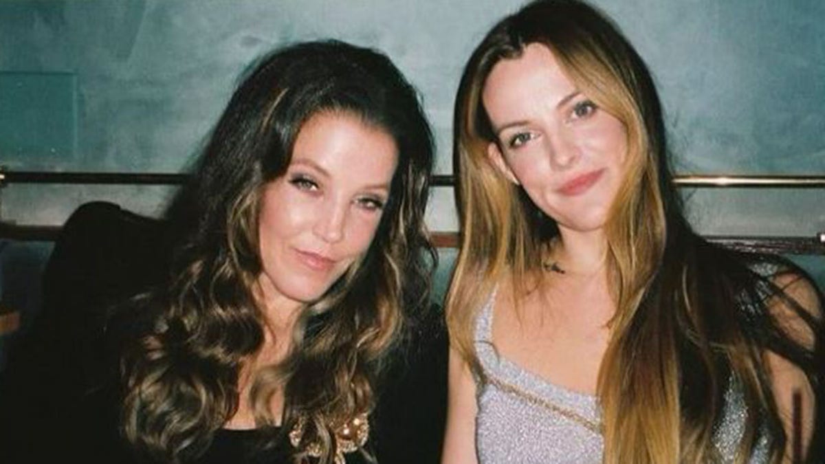 Lisa Marie Presley and daughter Riley Keough share a tender moment together at dinner