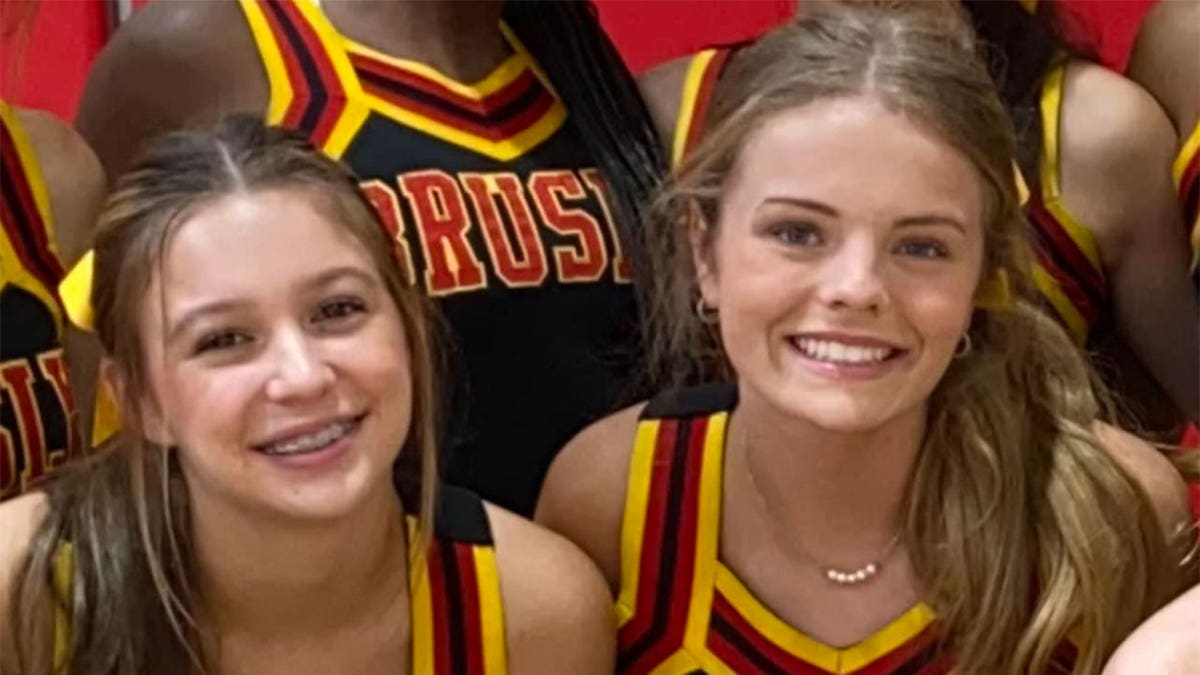 Maggie Dunn and Caroline Gill in cheer uniforms