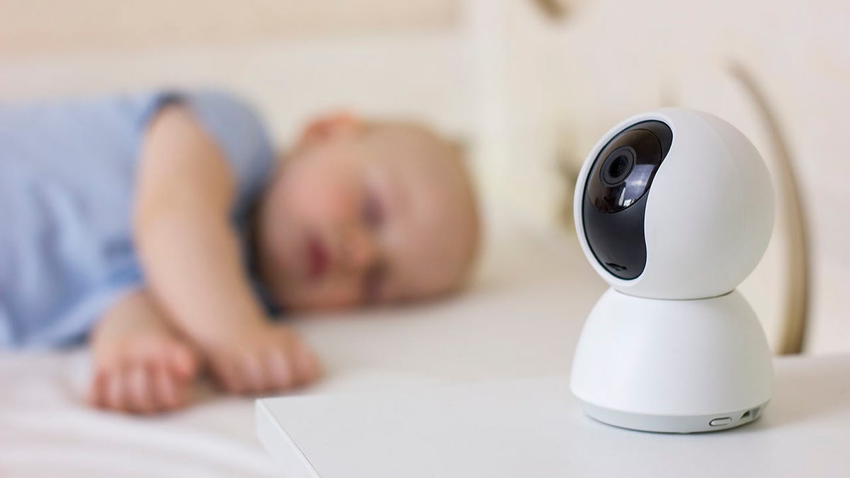 baby sleeping in front of monitor