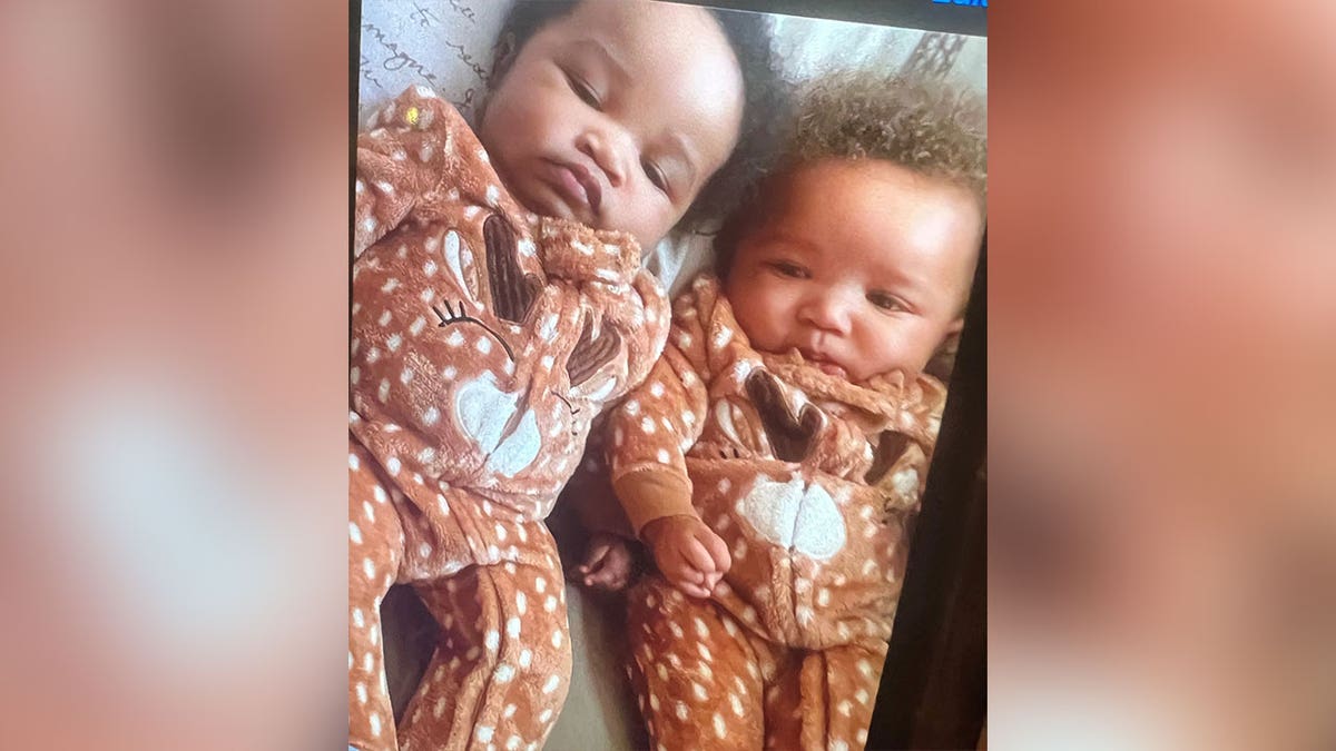 Twin infants Ky’air and Kason in matching onesies