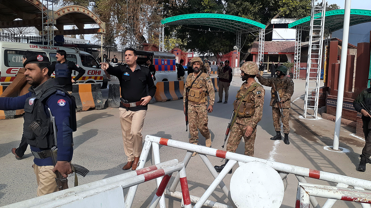 Soldiers near the scene of the explosion in Pakistan