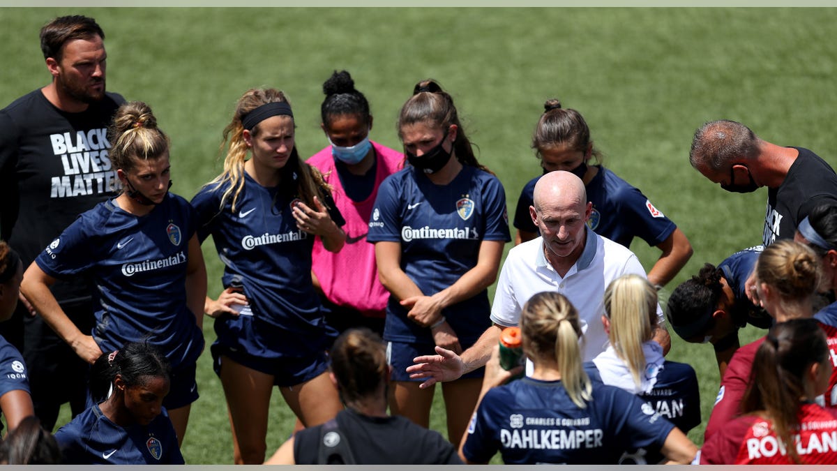 Paul Riley talks to team
