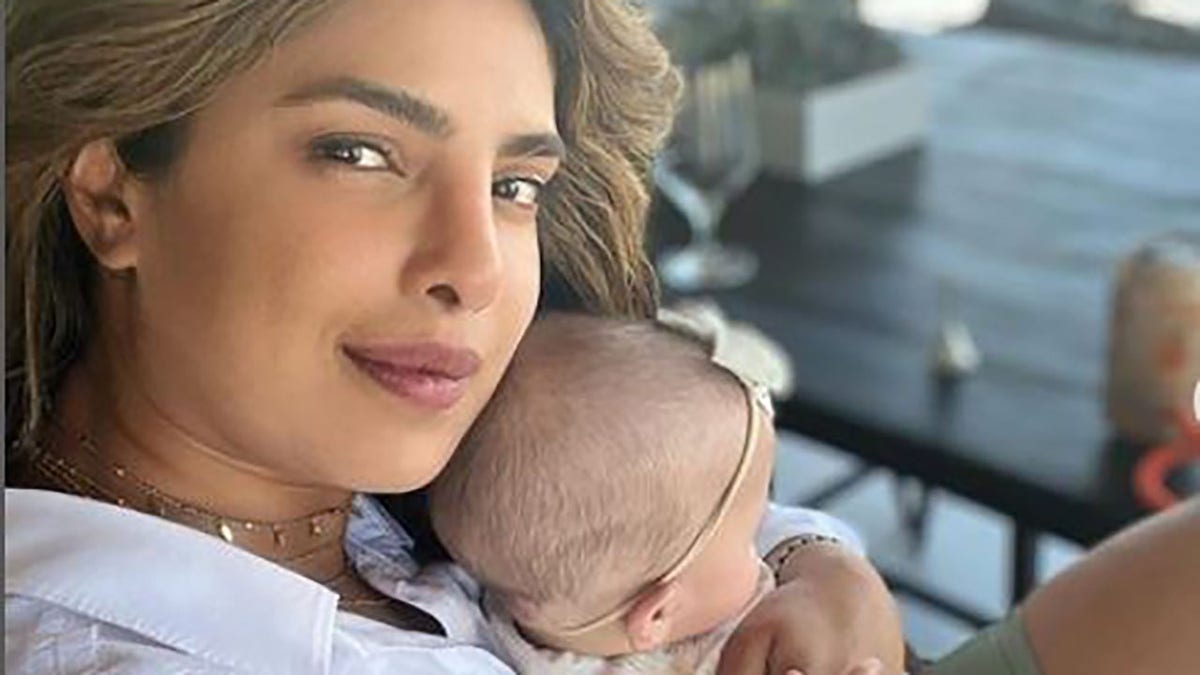 Priyanka Chopra holding her daughter