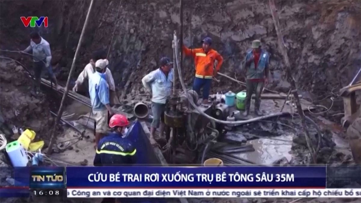 Vietnam rescue crews try to say boy down concrete hole