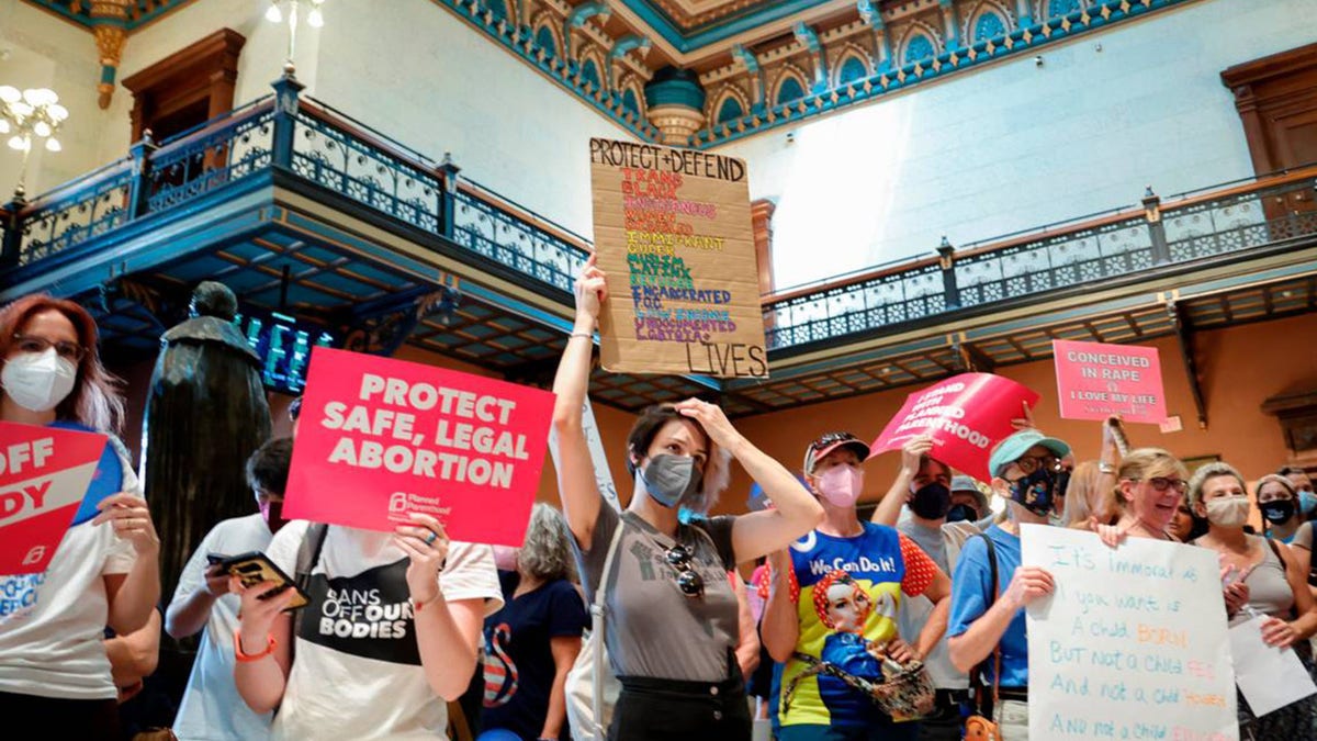 Abortion rights protesters rally inside the South Carolina Statehouse