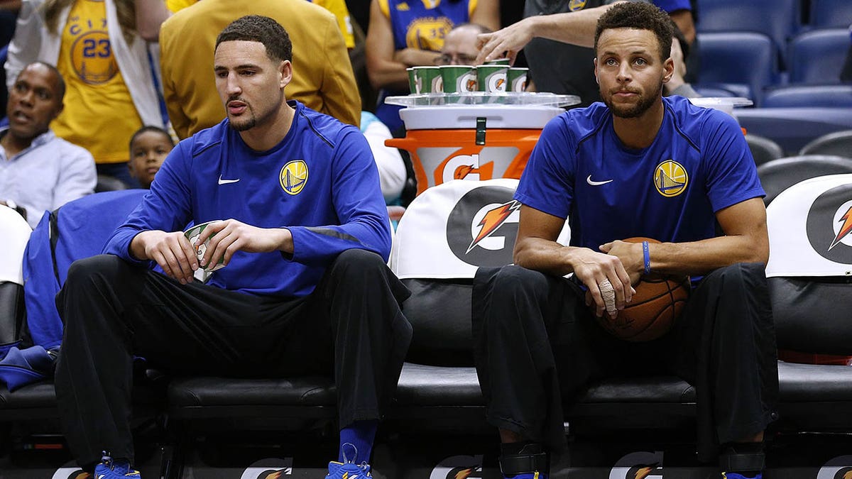 Steph and Klay on bench