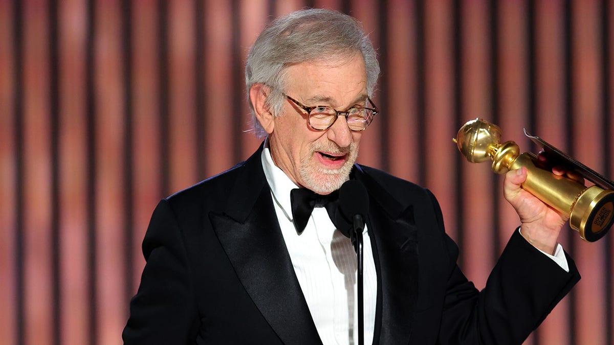 Steven Spielberg holding his award