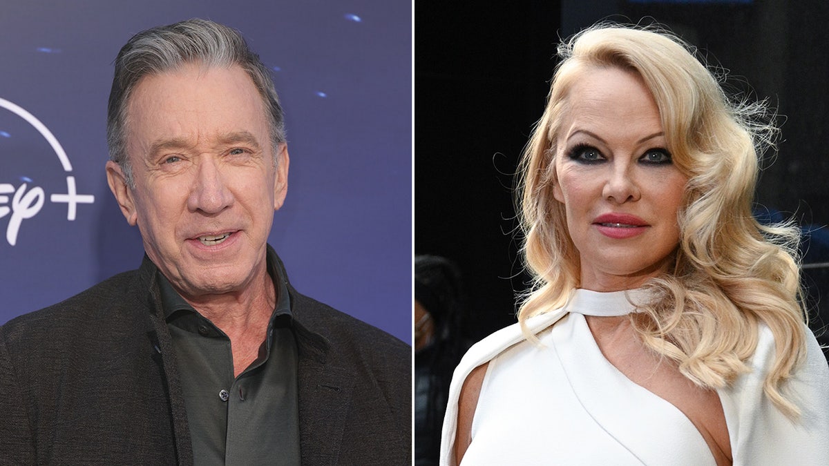 Tim Allen in a black suit and dark grey shirt on the red carpet split Pamela Anderson in a white gown that wraps around the neck 