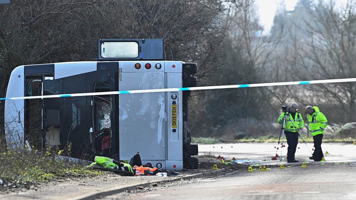 police investigating scene of bus crash