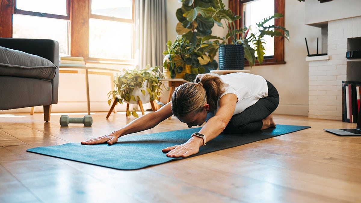 woman doing yoga health and fitness