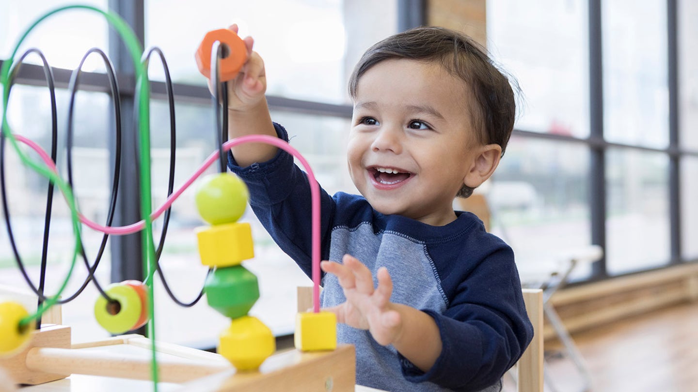 toddler playing with toys