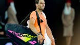 Rafael Nadal of Spain acknowledges the crowd after losing the round two singles match against Mackenzie McDonald of the United States during day three of the 2023 Australian Open at Melbourne Park on January 18, 2023 in Melbourne, Australia.