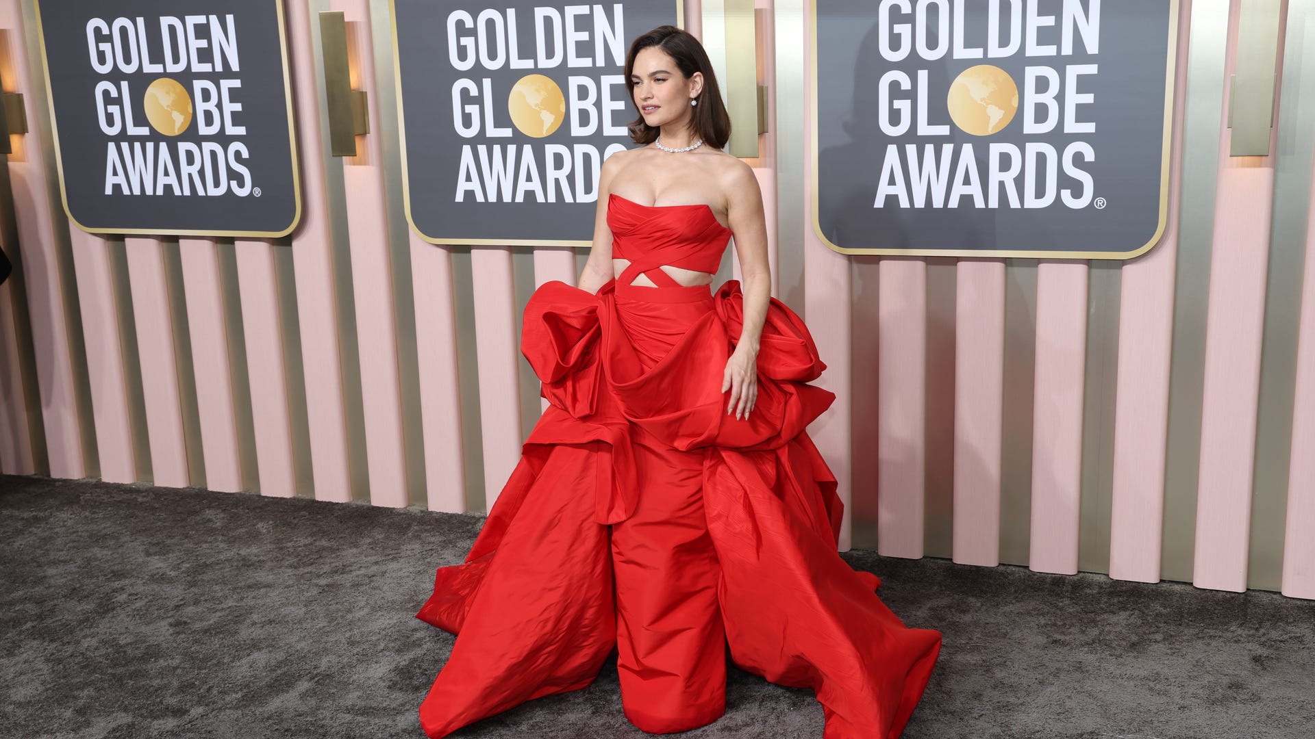 Lily James in a red dress