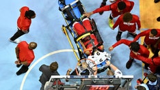 NC State's Terquavion Smith stretchered off the floor after scary fall, team says he's 'day-to-day'