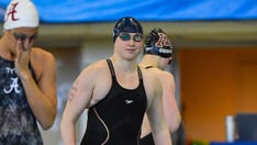 Transgender male swimmer struggling against new competition after earning All-American honors as female
