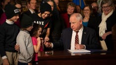 Minnesota Gov. Walz gives tax relief bill 1st signature of legislative session