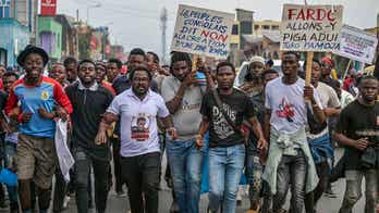 Congo police fire tear gas at unauthorized protestors opposing the presence of foreign troops