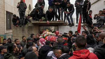 Israel deports Italian activist after she was detained during a raid in the occupied West Bank