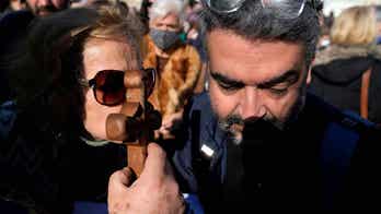 Greeks celebrate Epiphany with blessings of the water after 2 years of COVID restrictions