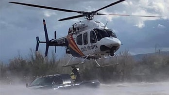 Arizona helicopter crew rescues driver from flash flooded creek: 'precarious situation'