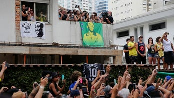 Brazil's president, thousands of mourners line streets to pay final respects to legendary soccer player Pelé