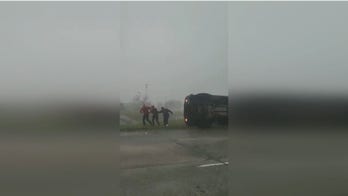 Houston UPS driver rescued after truck topples onto side during powerful tornado that ripped through region