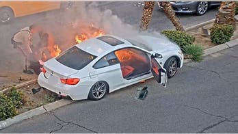 Las Vegas police officer, good Samaritan pull crashed motorist to safety moments before car bursts into flames