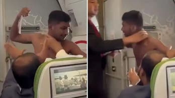 Punches fly as shirtless man brawls with fellow airline passenger over seat assignment