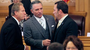 In Kansas, tensions mount between Democrat governor and GOP legislature over surplus plans