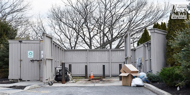 Police removed the dumpster, located at the home of Diane Walshe, to inspect for evidence Tuesday, Jan. 10, 2023 in Swampscott, Mass. Walshe's husband, Brian, is in custody for allegedly misleading police as they investigate the disappearance of his wife.