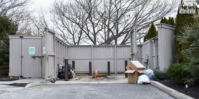 Police removed the dumpster, located at the home of Diana Walshe, to inspect for evidence on Tuesday, Jan. 10, 2023 in Swampscott, Mass. 