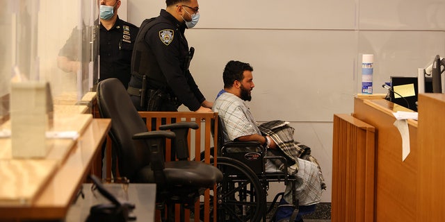 Adem Nikeziq sits in a wheelchair in Staten Island Arraignment court. 