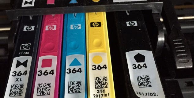 Printer ink cartridges in a printer.