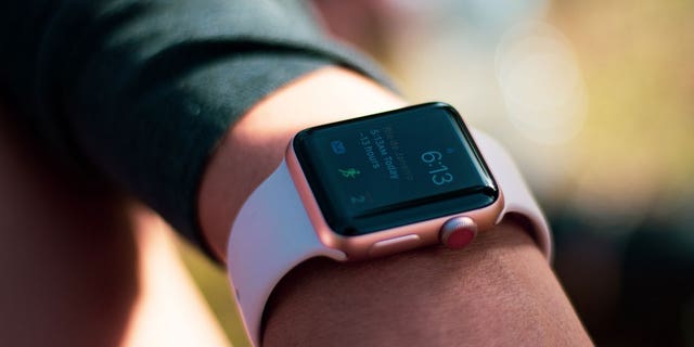Apple Watch with fitness app open.