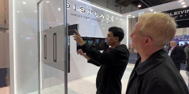 Essentially, the TV's donut-shaped mounting rings on the back can tell what is needed to hold the TV to a wall or surface.