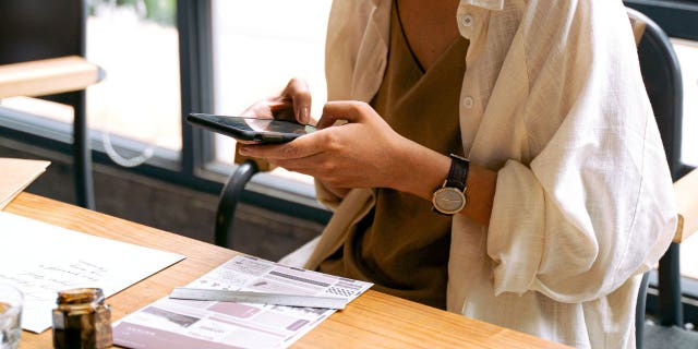 A woman has been pictured possibly trying to access her phone after her SIM card was hacked.