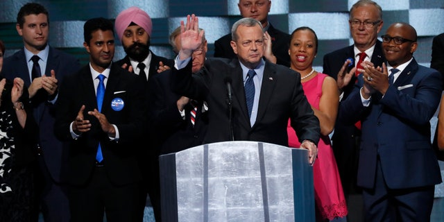 Retired U.S. Marine General John Allen (C) is applauded while addressing the final night of the Democratic National Convention in Philadelphia, Pennsylvania, U.S. July 28, 2016. REUTERS/Mike Segar