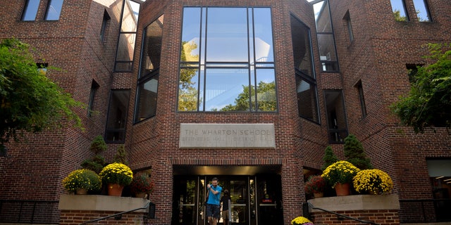 A student leaves the Wharton School of Business on the campus of the University of Pennsylvania in Philadelphia, Pennsylvania, U.S., September 25, 2017.