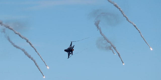A Taiwan air force F-16 drops flares during a live-fire military exercise in Pingtung, Taiwan, May 30, 2019.
