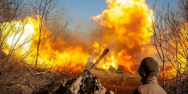 Ukrainian servicemen fire a 130 mm towed field gun M-46 on a front line, as Russia's attack on Ukraine continues, near Soledar, Donetsk region, Ukraine, in this handout image released November 10, 2022. 