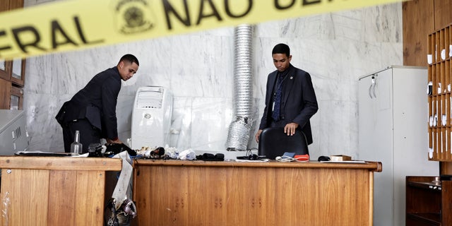 People inspect the damage, after the supporters of Brazil's former President Jair Bolsonaro anti-democratic riot at Planalto Palace, in Brasilia, Brazil, Jan. 9, 2023.