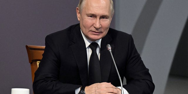 Russian President Vladimir Putin attends a meeting to mark the 80th anniversary of a breakthrough in the siege of Leningrad during World War II at the State Memorial Museum of the Defense and Siege of Leningrad in Saint Petersburg, Russia, Jan. 18, 2023.