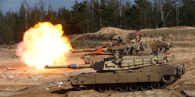 A US Army M1A1 Abrams tank fires during military exercise Crystal Arrow 2021 of the NATO Reinforced Forward Presence Battle Group in Adazi, Latvia, March 26, 2021.