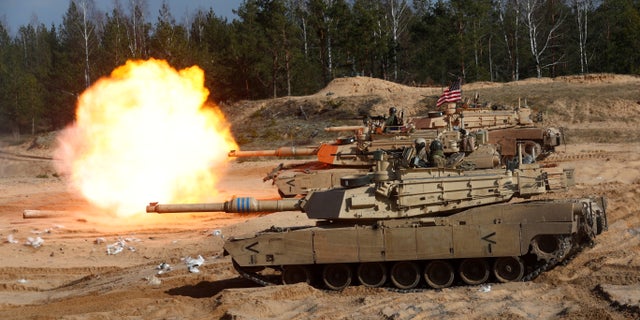 U.S. Army M1A1 Abrams tank fires during NATO enhanced Forward Presence battle group military exercise Crystal Arrow 2021 in Adazi, Latvia, on March 26, 2021.