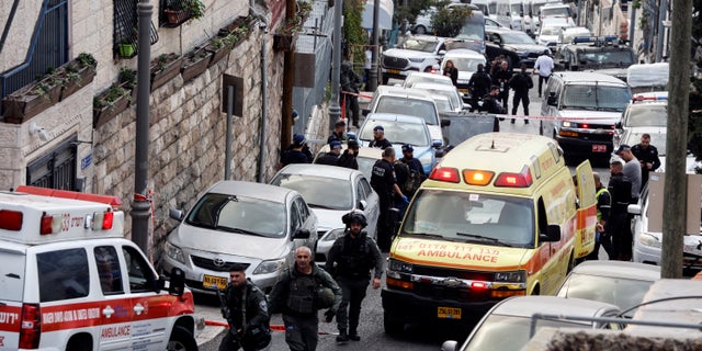Security and rescue personnel work at a scene where a suspected incident of shooting attack took place, police spokesman said, just outside Jerusalem's Old City January 28, 2023.