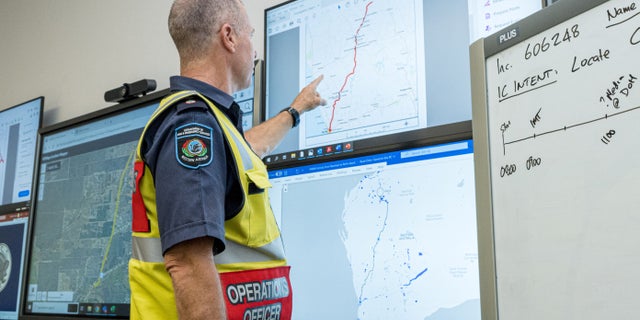 A member of the Incident Management Team coordinates the search for a radioactive capsule that was lost in transit by a contractor hired by Rio Tinto, at the Emergency Services Complex in Cockburn, Australia.