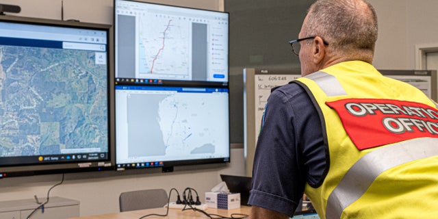 A member of the Incident Management Team coordinates the search for a radioactive capsule that was lost in transit by a contractor hired by Rio Tinto, at the Emergency Services Complex in Cockburn, Australia.