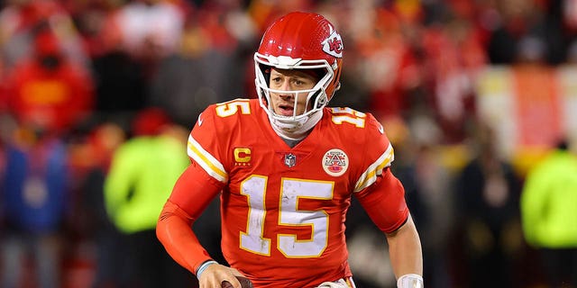 Patrick Mahomes #15 of the Kansas City Chiefs looks to pass against the Cincinnati Bengals during the fourth quarter in the AFC Championship Game at GEHA Field at Arrowhead Stadium on Jan. 29, 2023 in Kansas City, Missouri. 