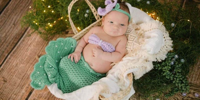 Eleven-week-old Gwen Ayers, pictured here, managed to sleep through the crash and was entirely unharmed.