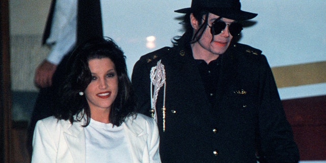 This August 16, 1994 file photo shows US pop star Michael Jackson and his then wife Lisa-Marie Presley arriving at the airport in Budapest.